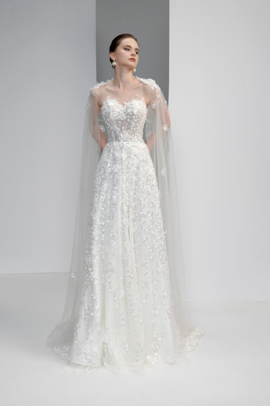 White wedding dress with lace details on a plain background