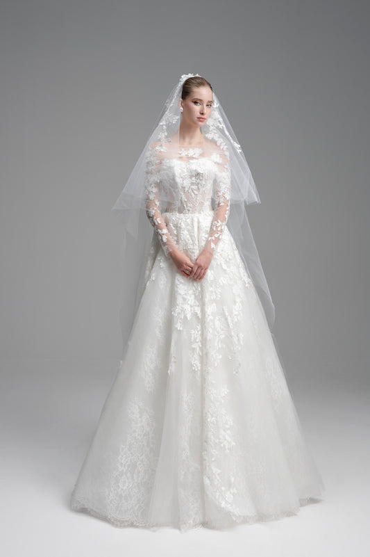 White wedding dress with a veil on a gray background