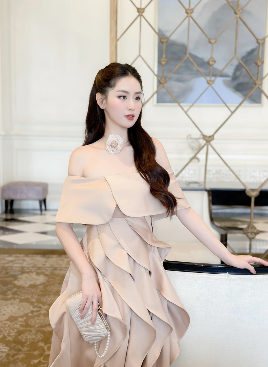 Model Posing in Nude Off-Shoulder Ruffled Skirt Dress with Silver Heels
