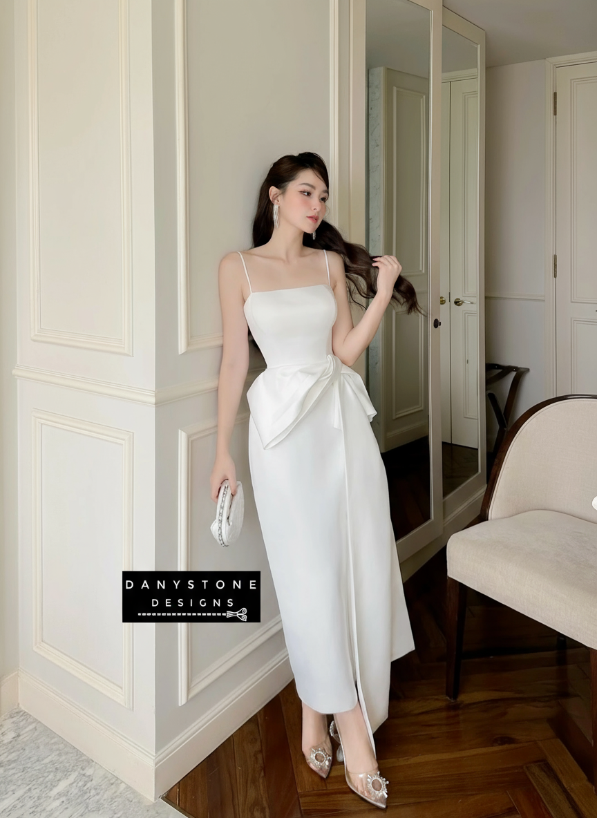 View of white 2-Strap Dress Showcasing Bow Detail and Fabric Texture