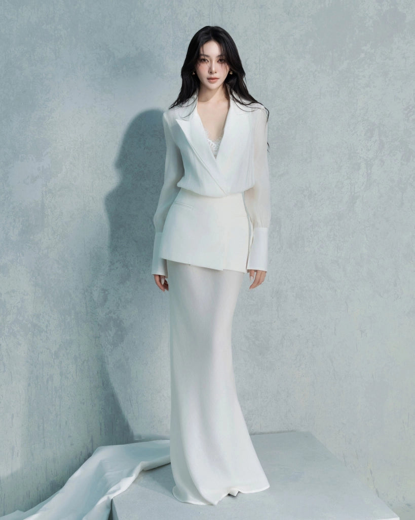 Woman wearing a black dress with a white belt on a white background