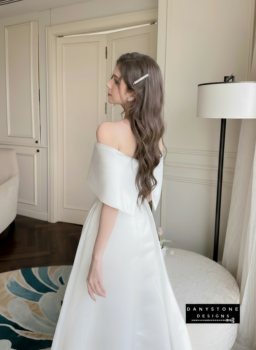 Close-Up of Off-Shoulder Neckline on White Party Dress