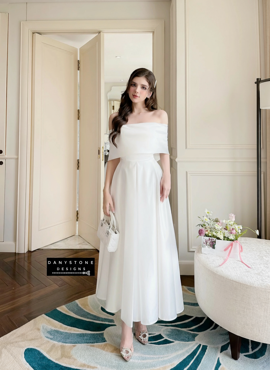 View of White Off-Shoulder Dress Highlighting Flowing Silhouette