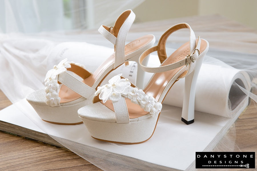 Close-up view of the floral detail on the Elegant White Floral Wedding High Heels.