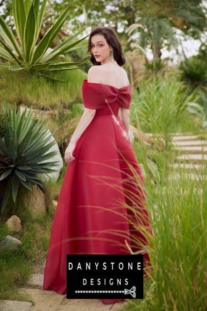 Stylish red silk chiffon dress with off-shoulder design and bow