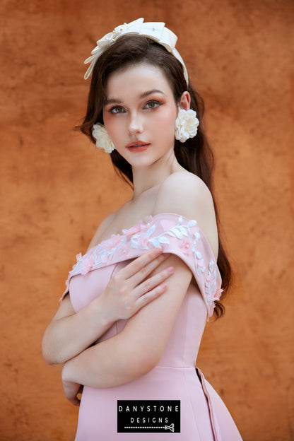 Elegant pink satin dress with off-shoulder neckline and embossed flowers