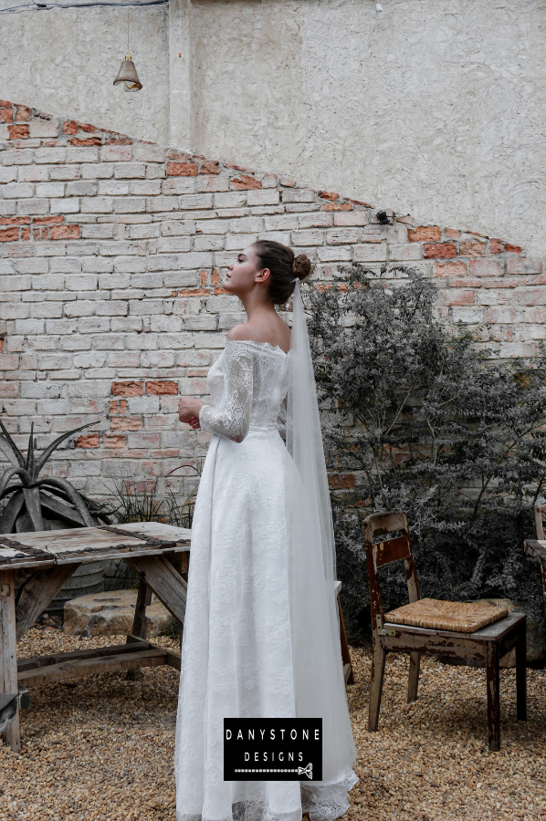 A close-up detail of the intricate lace pattern on the thin lace dress.