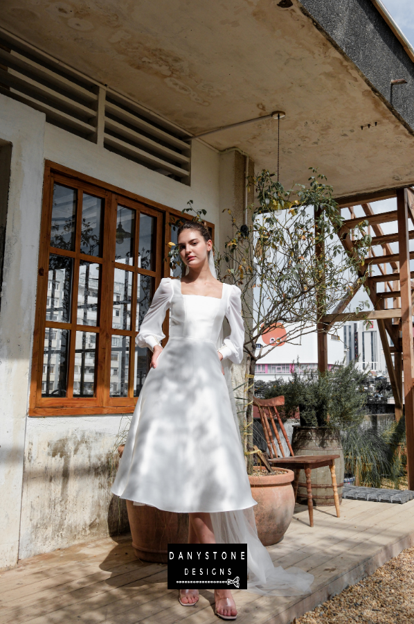 Square Neck Tafta Bridal Gown - Full view of the model wearing the square neck tafta bridal gown with a flowing skirt.