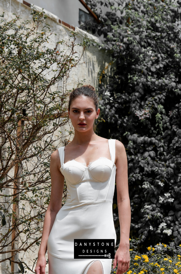 Model posing in the satin corset dress with lace accents, highlighting the details.