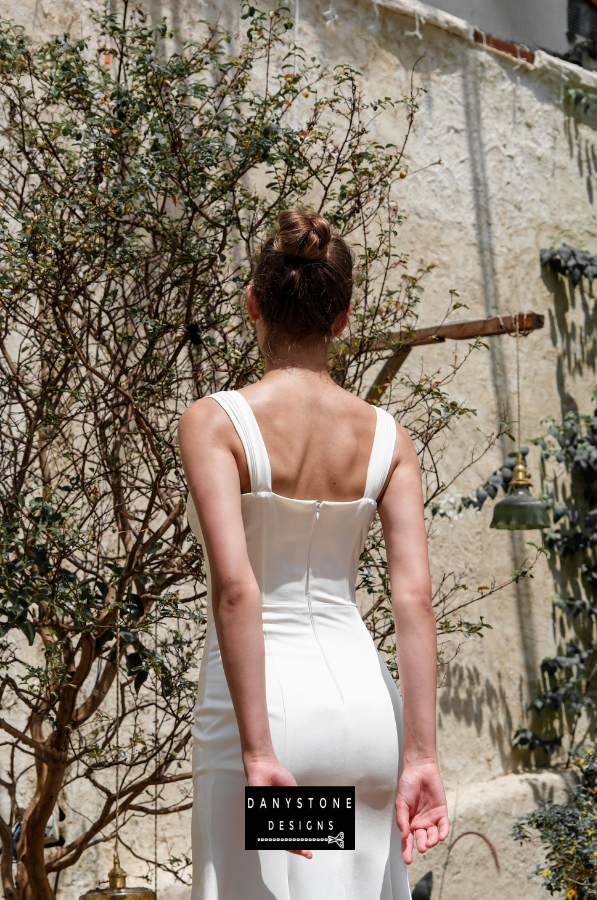 A back view of the satin corset dress highlighting the structured bodice and elegant satin fabric.