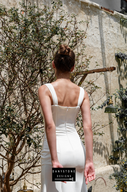 A back view of the satin corset dress highlighting the structured bodice and elegant satin fabric.