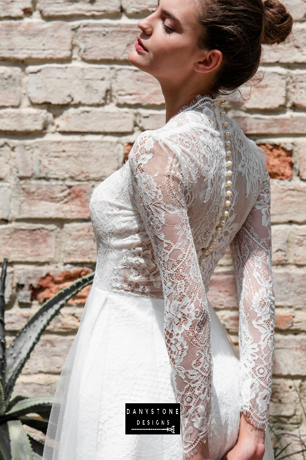 Close-up of the back view highlighting the elegant buttons and intricate lace detailing.