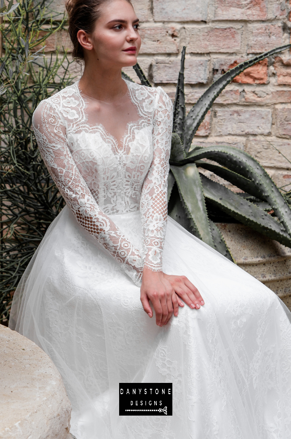 Close-up of the model seated, highlighting the intricate lace patterns and delicate mesh parts.