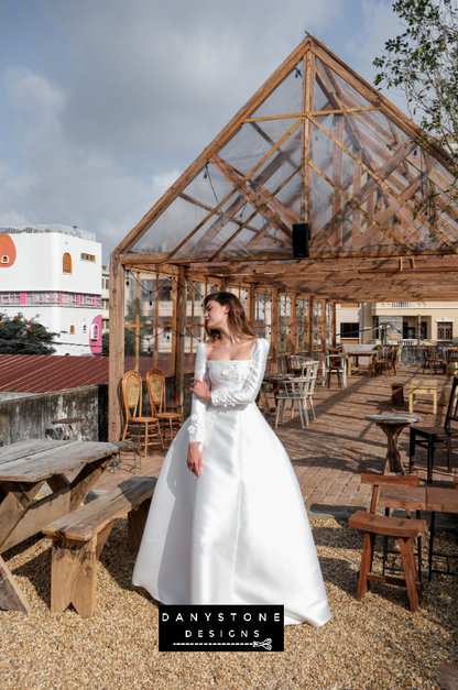 A full-length view of the model wearing the 7-piece tafta dress showcasing the elegant design.