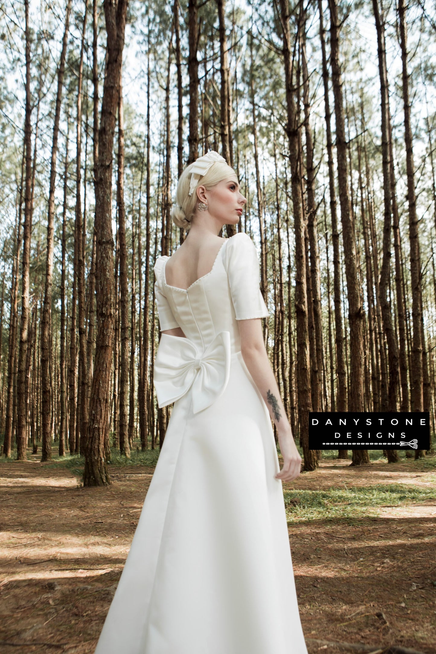 Back view of square-neck wedding dress with large bow detail and full skirt – Danystone Designs