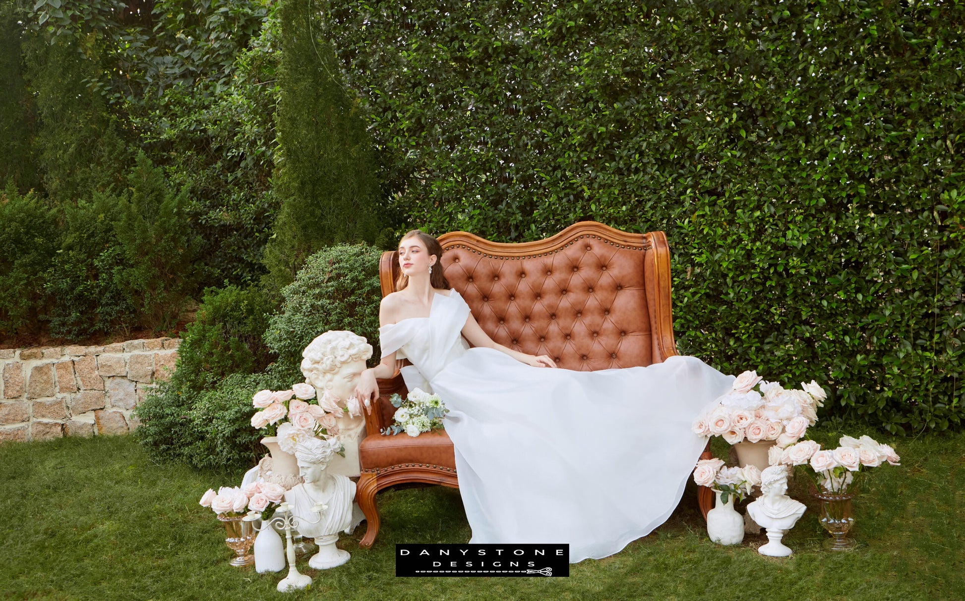 Timeless Silk Chiffon Wedding Gown - Model posing outdoors, highlighting the off-the-shoulder neckline and the enchanting flow of the silk chiffon fabric.