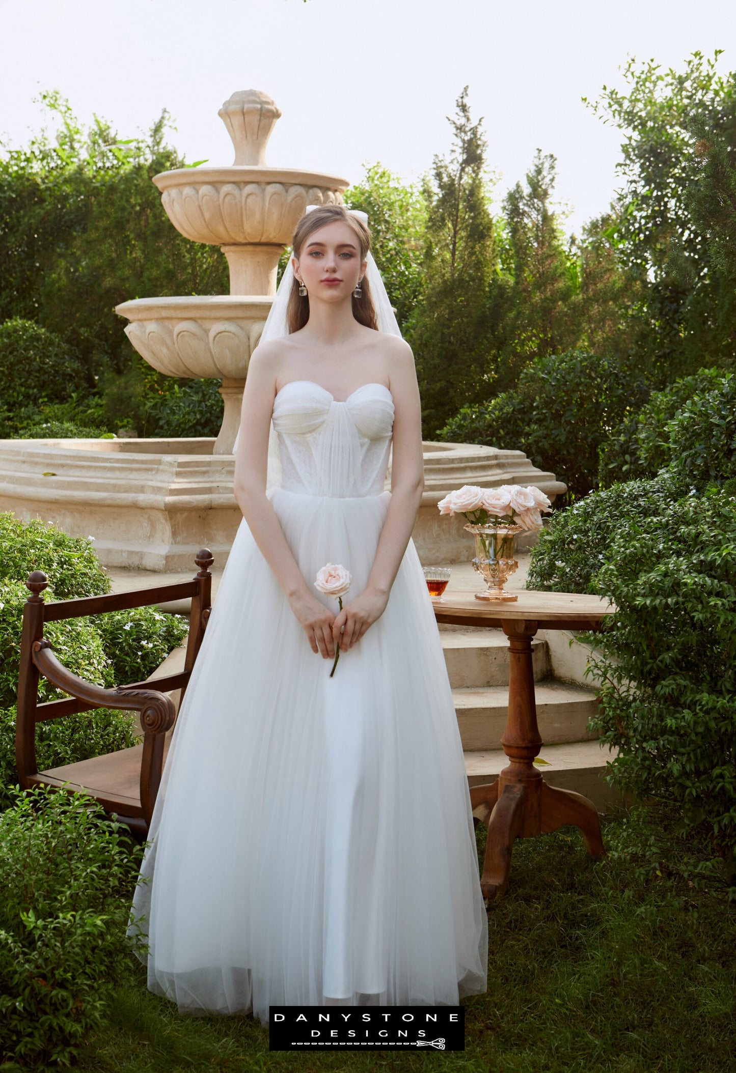 Bride in strapless wedding dress with flowing skirt in garden – Danystone Designs