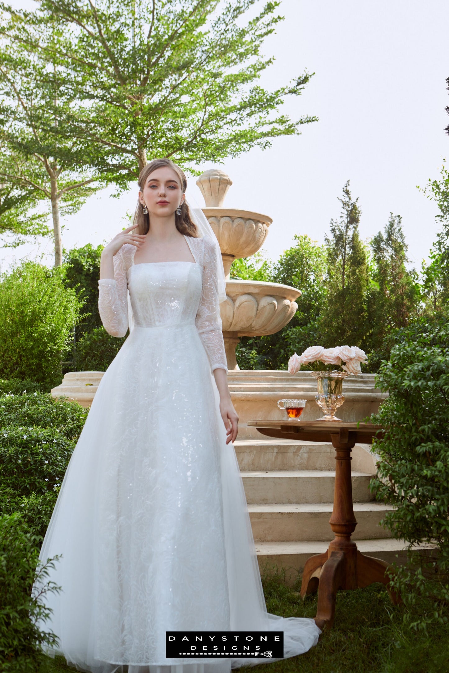 Timeless Cinderella Wedding Dress - Model standing gracefully in the Cinderella mesh long dress, showcasing the sparkling mesh overlay and elegant design.