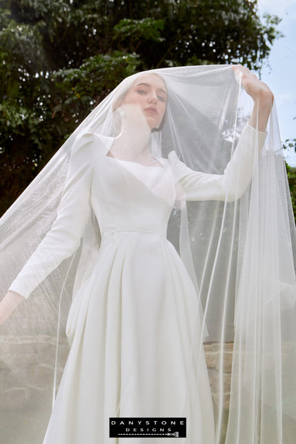 Regal Snow White Queen Neck Bridal Dress - Model standing gracefully in the Snow White Queen Neck Satin dress, exuding elegance and sophistication.