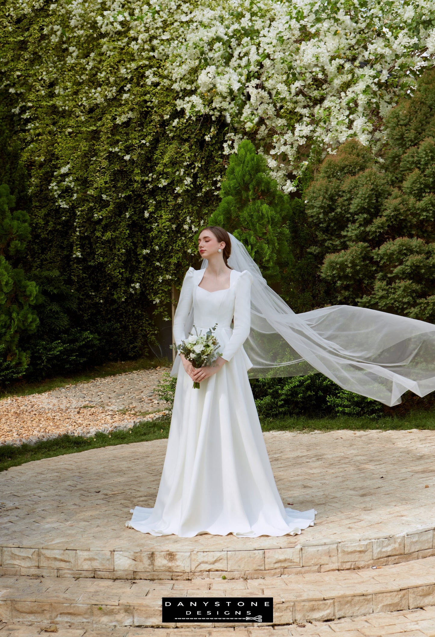 Regal Snow White Queen Neck Bridal Dress - Model standing gracefully in the Snow White Queen Neck Satin dress, exuding elegance and sophistication.