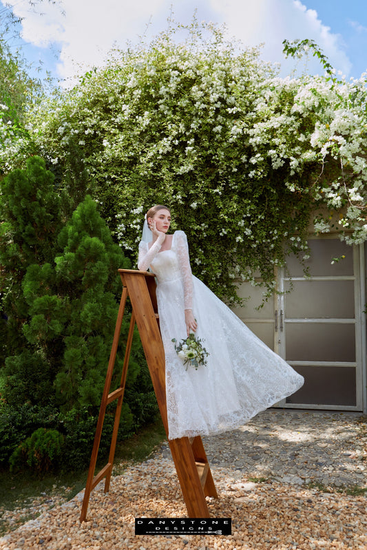 Cinderella Long Sleeve Square Neck Dress - Side View - Model showcasing the side view of the Cinderella long sleeve square neck dress with intricate lace detailing.