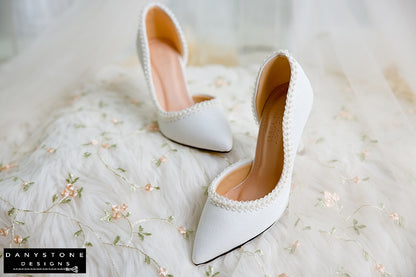 Wedding shoes with pearl trim, made from metallic scratched leather, featuring elegant heels.