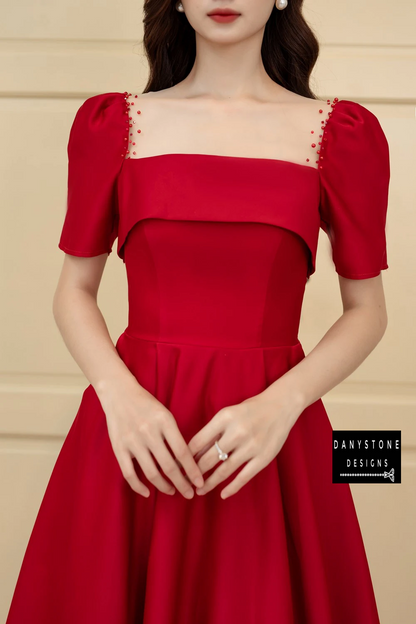 Close-Up of Pearl-Embellished Sleeves and Square Neckline on Red Ruffled Wedding Dress