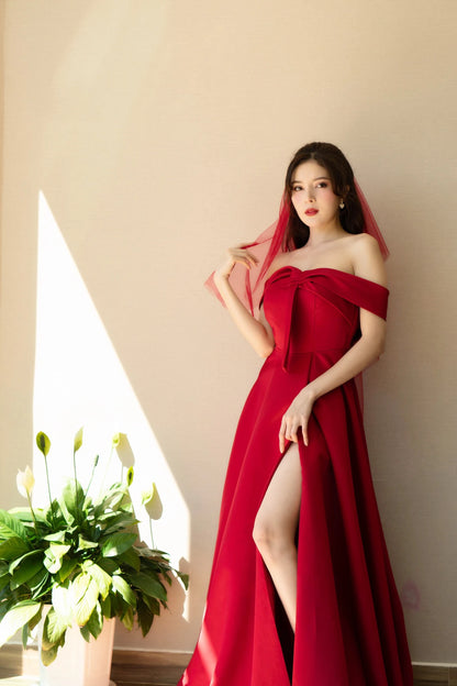 Bride in Red Off-the-Shoulder Wedding Dress with Thigh-High Slit Posing Gracefully