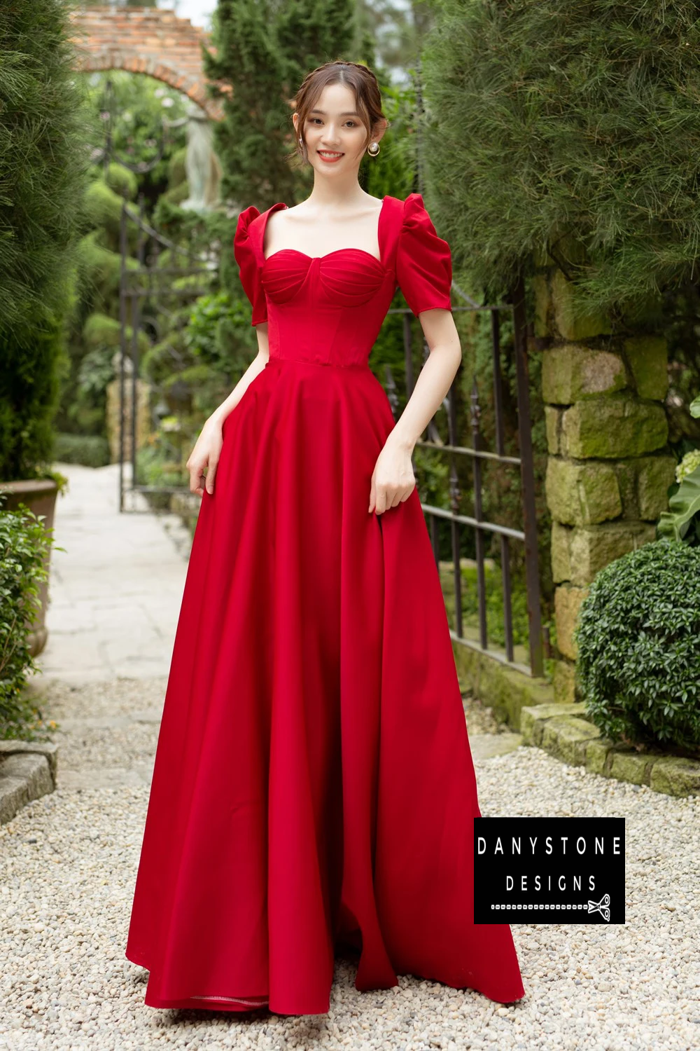 Full-Length View of Bride Wearing Red Pleated Wedding Dress