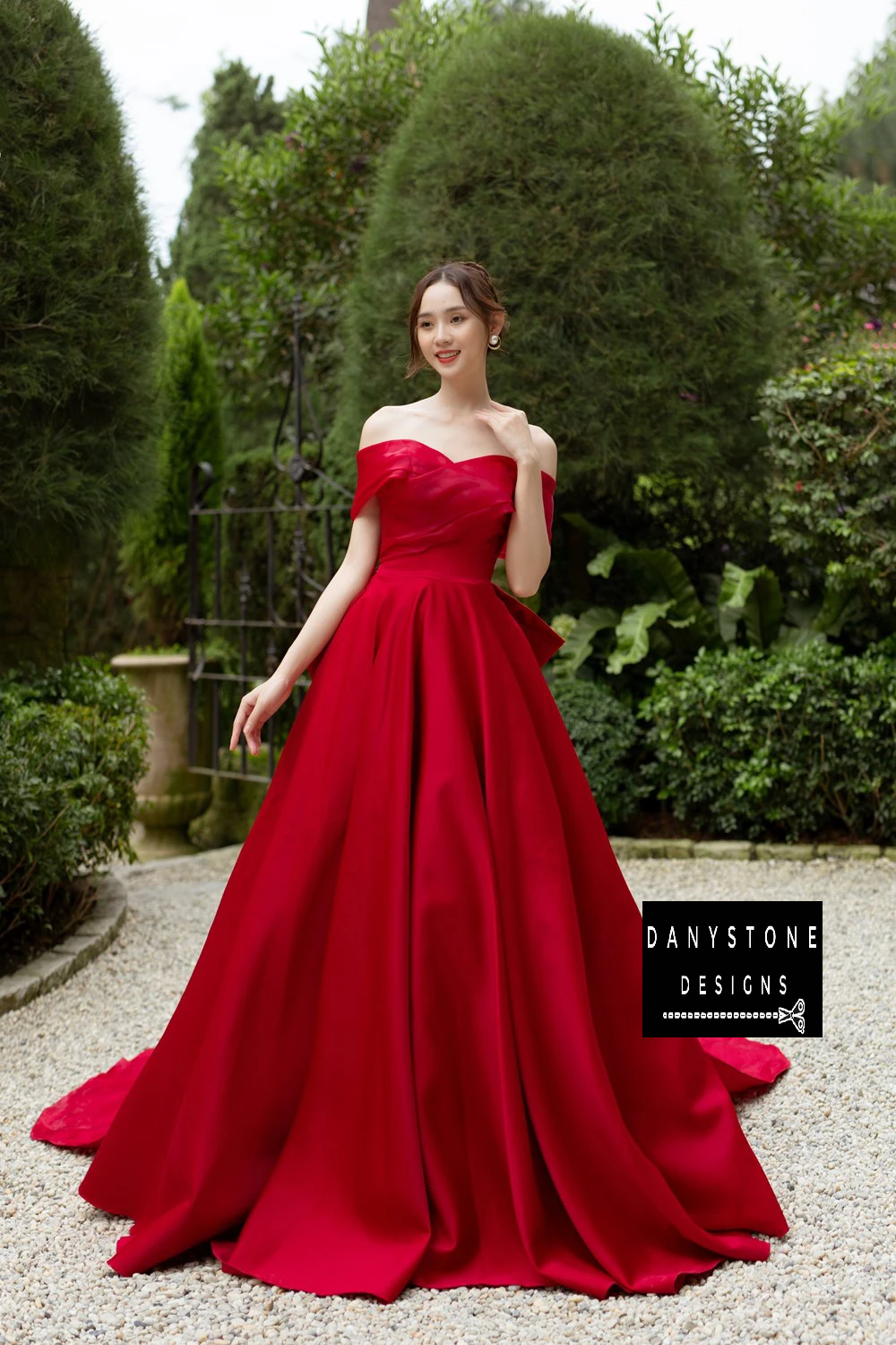 Detailed View of Large Red Bow on Back of Wedding Dress