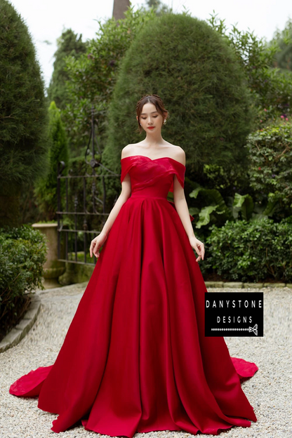 Bride Smiling in Puffy Chiffon Off-the-Shoulder Wedding Dress with Red Bow