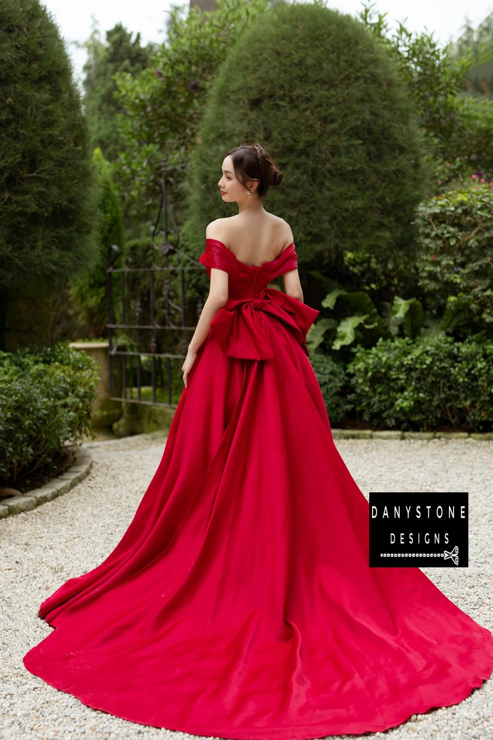 Back View of Puffy Chiffon Wedding Dress with Large Red Bow