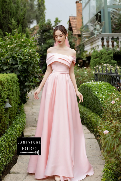 Detailed View of Cross-Waist Design on Pink Wedding Dress