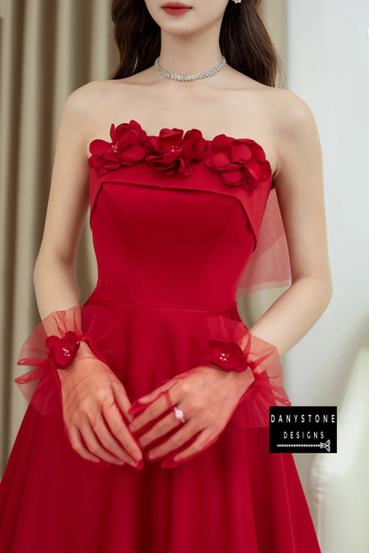 Bride Posing in Red Off-the-Shoulder Wedding Dress with Brocade Floral Details