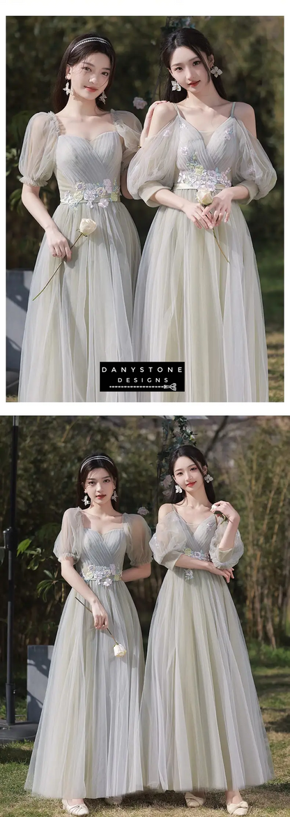 Models holding flowers in green boho wedding dresses