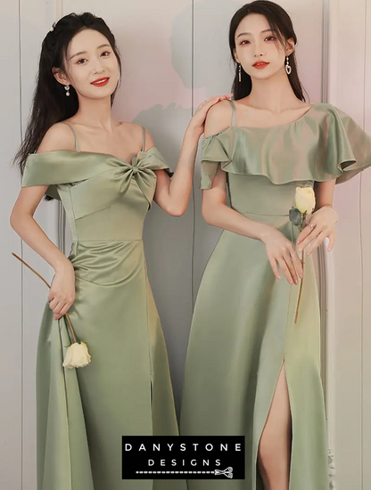 Models posing in green satin dresses with high slits