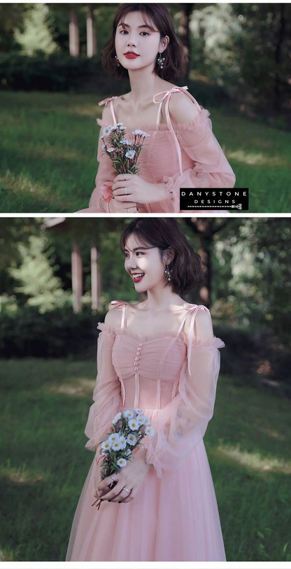 Models in pink tulle dresses at formal event