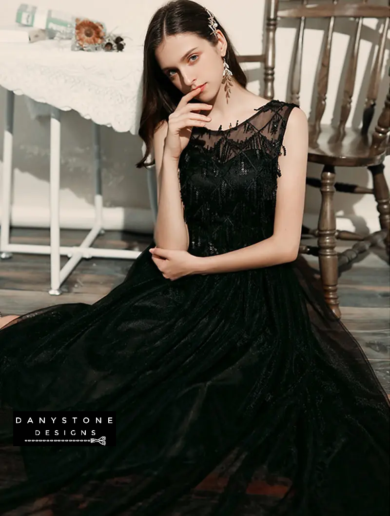 Black chiffon dress with flutter sleeves detail