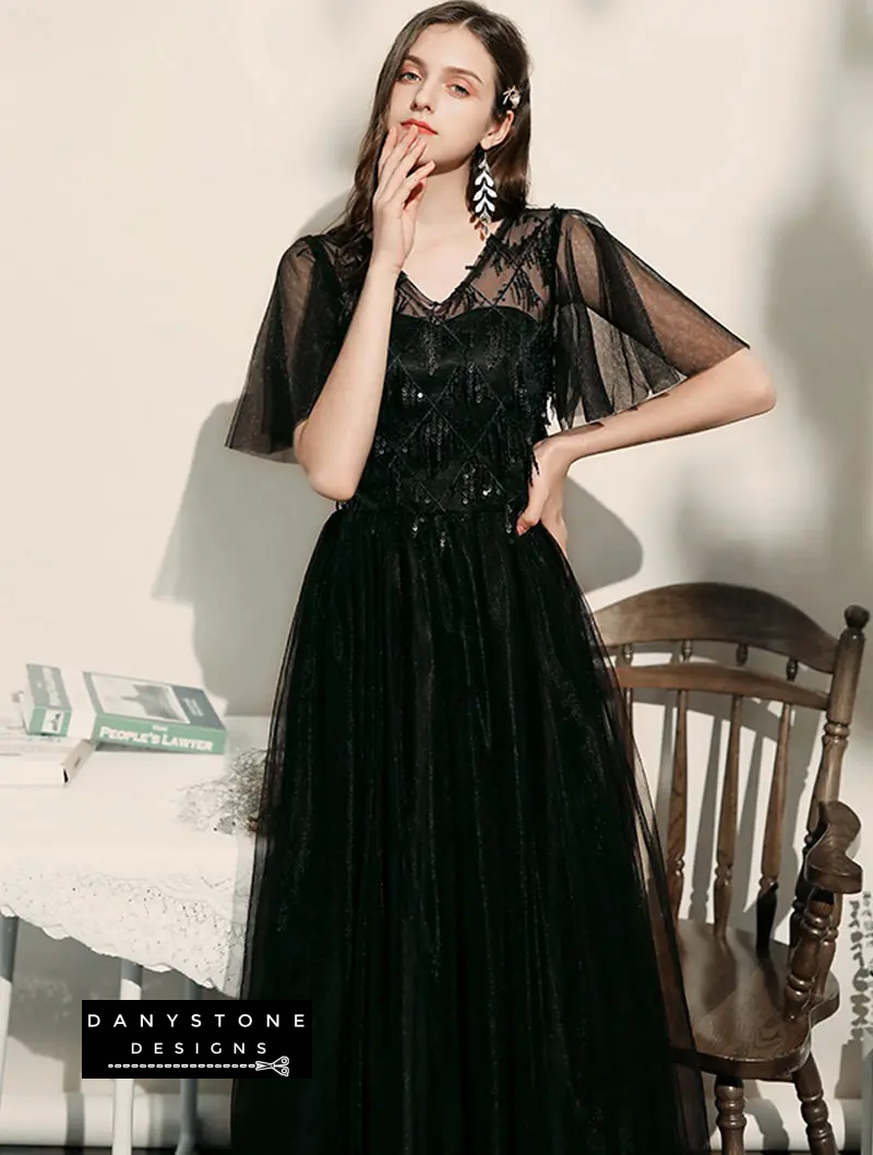 Model wearing black chiffon bridesmaid gown