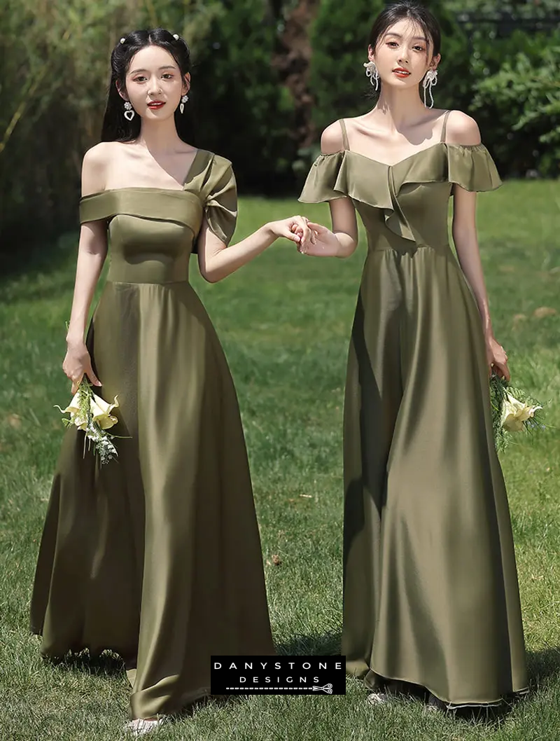 Models holding flowers in green satin bridesmaid dresses