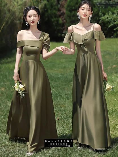 Models holding flowers in green satin bridesmaid dresses