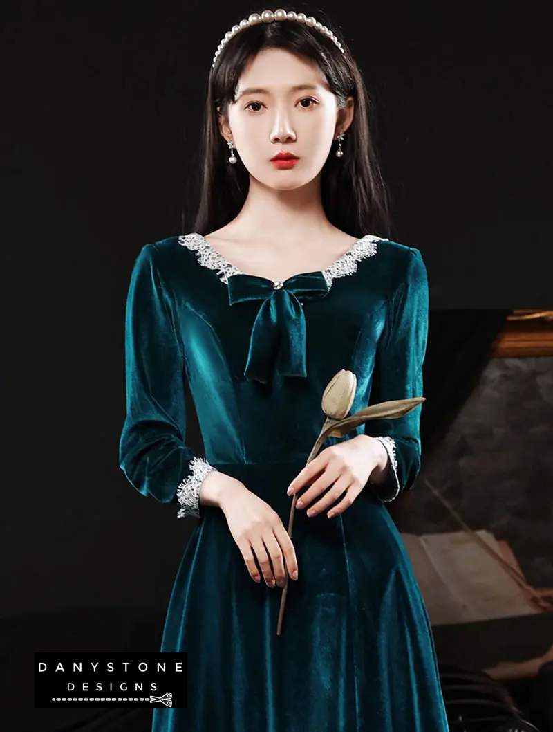 Full-length view of peacock blue formal dress