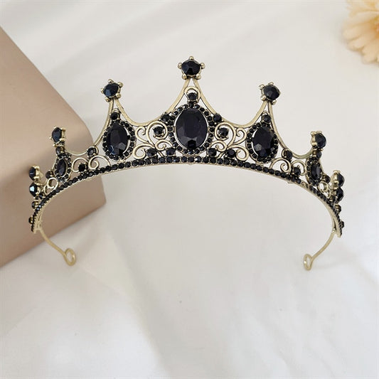 5cm high bridal crown featuring black stones set in an intricate gold-toned design.