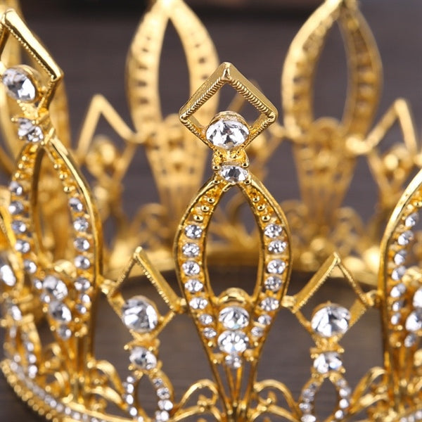 Golden bridal crown designed for high bun hairstyles, featuring sparkling crystals and a 9cm diameter with an 11cm height.