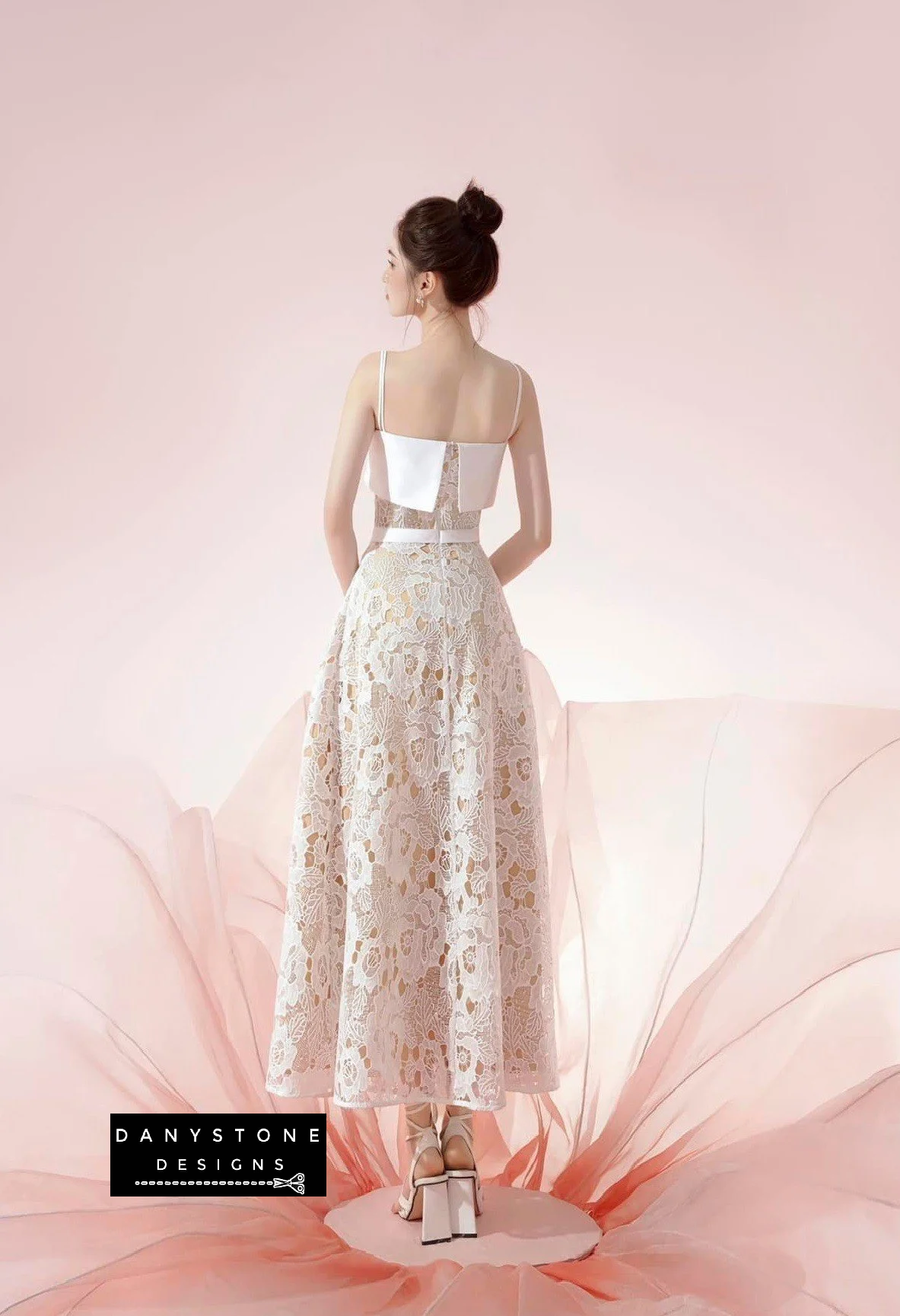 Back view of elegant lace two-strap flared dress