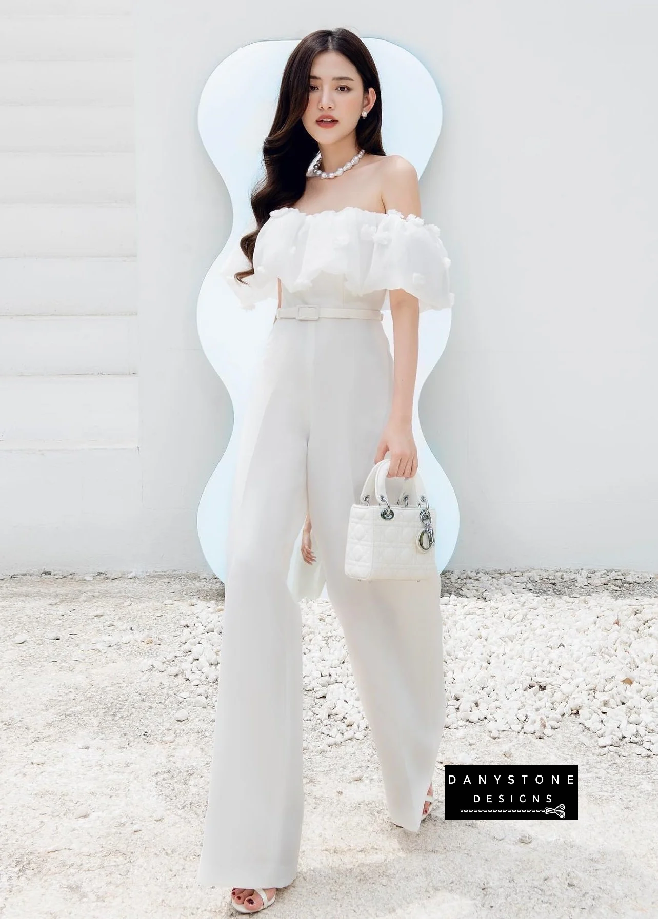 Chic white off-shoulder long jumpsuit front view