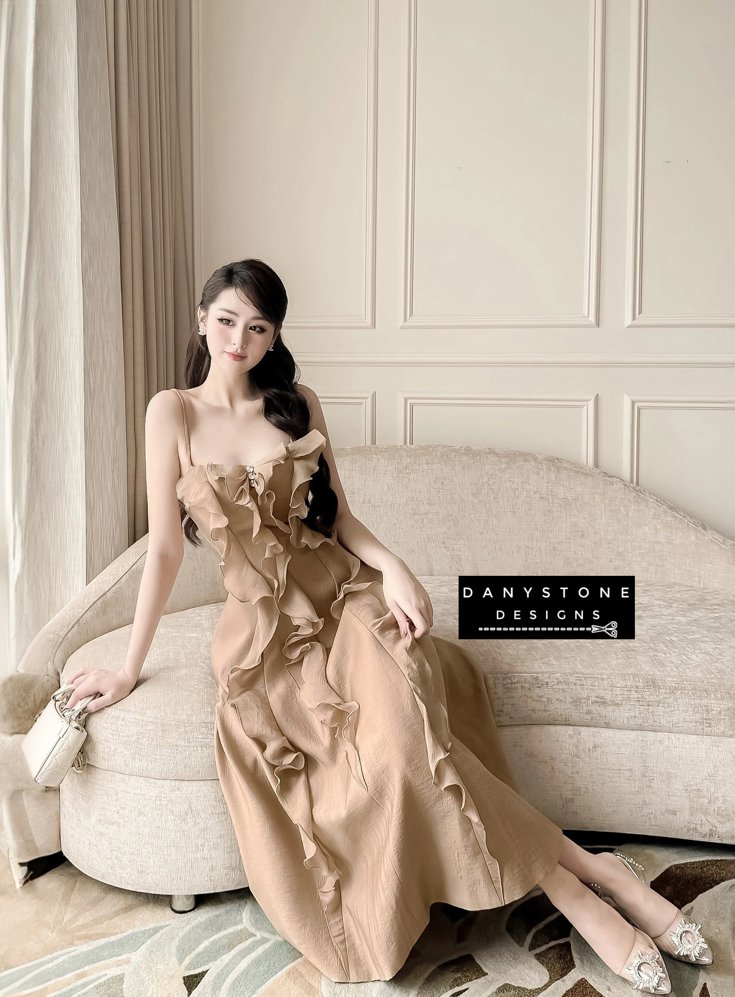 Brown 2-Strap Ruffled Dress with Model Sitting on Sofa