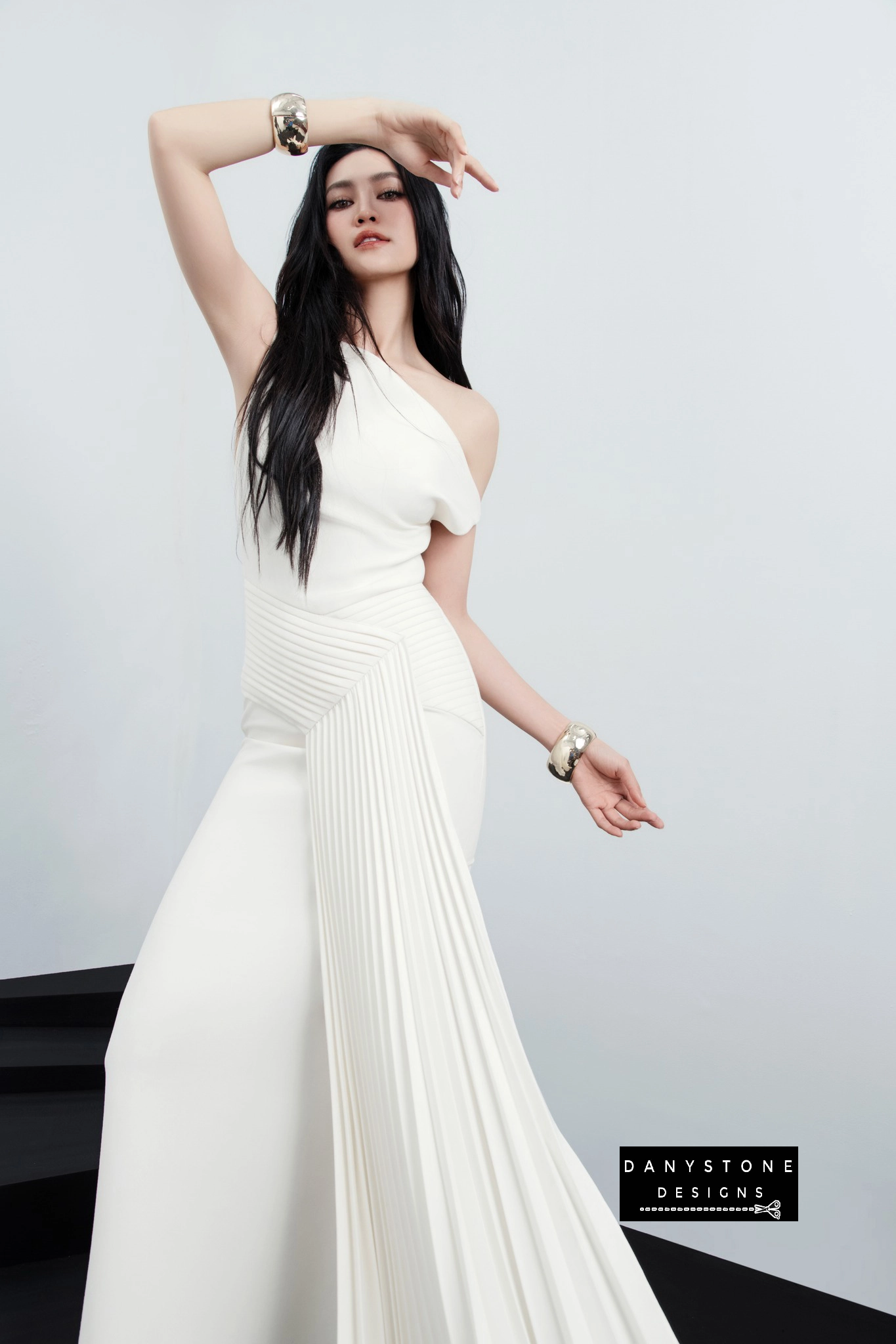 Model Wearing White One-Shoulder Pleated Gown