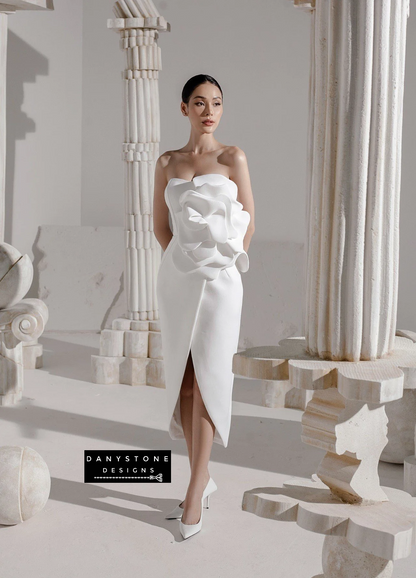 Model showcasing elegant floral pleated bodycon dress with bust in white