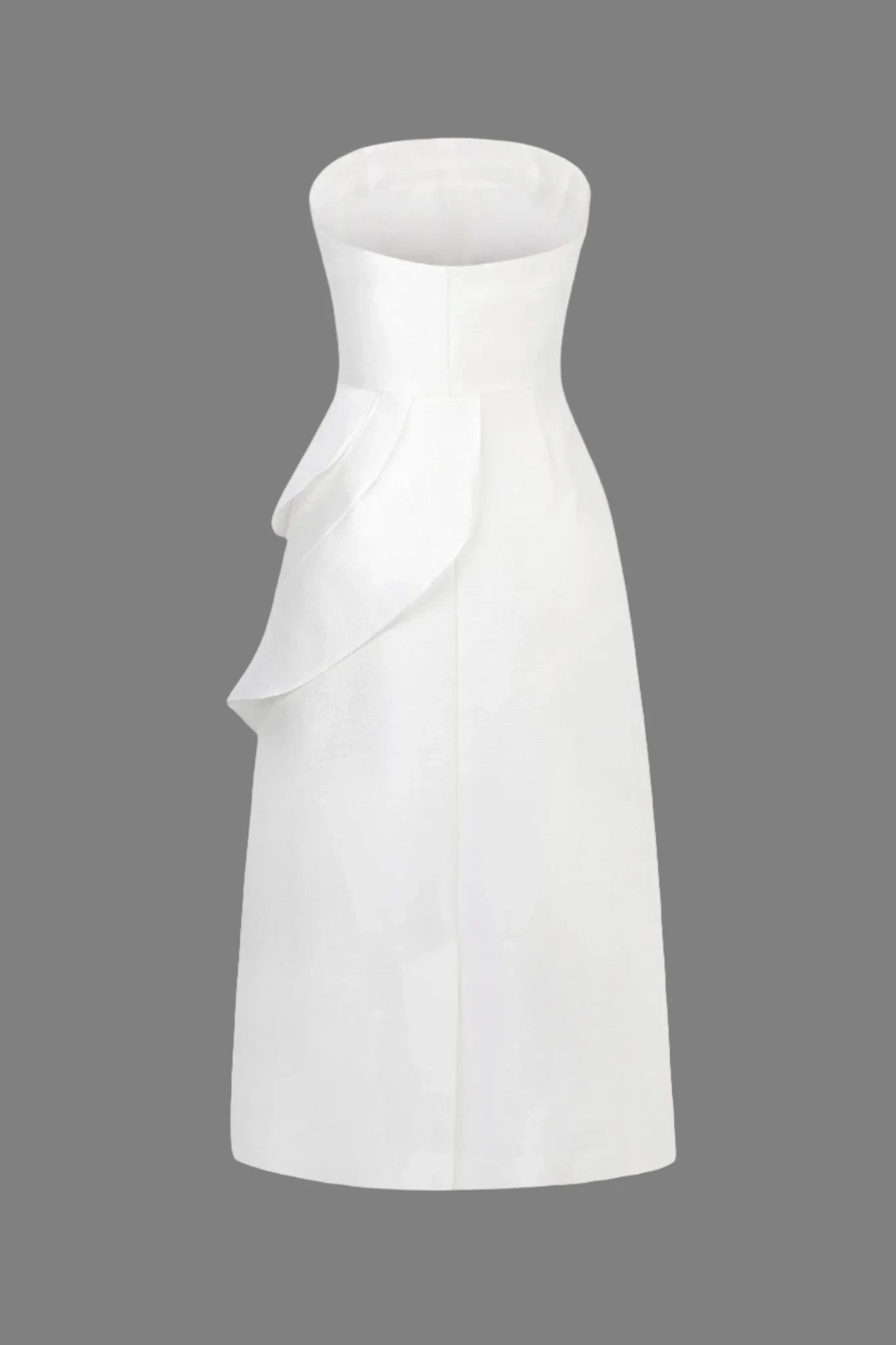 Model showcasing simple and elegant ruffled front strapless dress in white